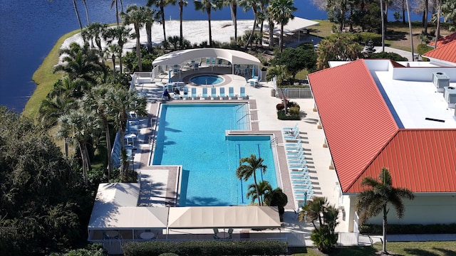 birds eye view of property with a water view