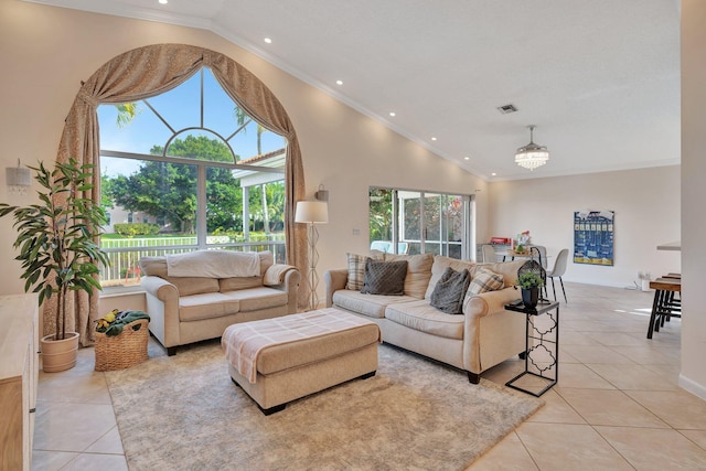 living area with light tile patterned floors, visible vents, ornamental molding, high vaulted ceiling, and recessed lighting