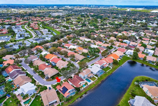 birds eye view of property featuring a residential view and a water view