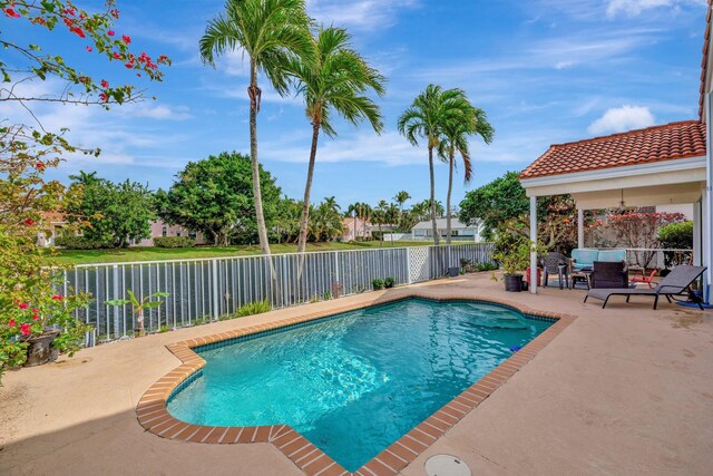 view of patio featuring a fenced in pool and a fenced backyard