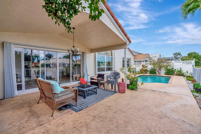 1048 Siena Oaks Cir E, Palm Beach Gardens, FL 33410 - view of patio with a fenced backyard and a fenced in pool