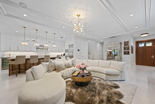 living room featuring wine cooler and a chandelier