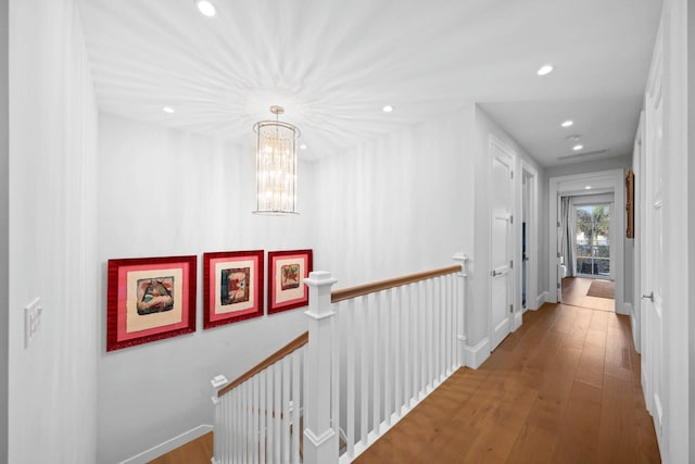 hall with hardwood / wood-style flooring