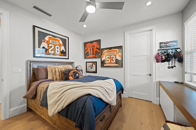 bedroom with ceiling fan and light hardwood / wood-style flooring