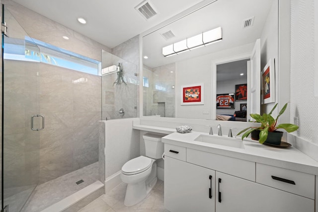 bathroom with vanity, toilet, and walk in shower