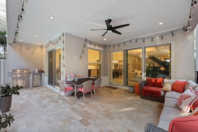 view of patio featuring ceiling fan, an outdoor kitchen, and grilling area