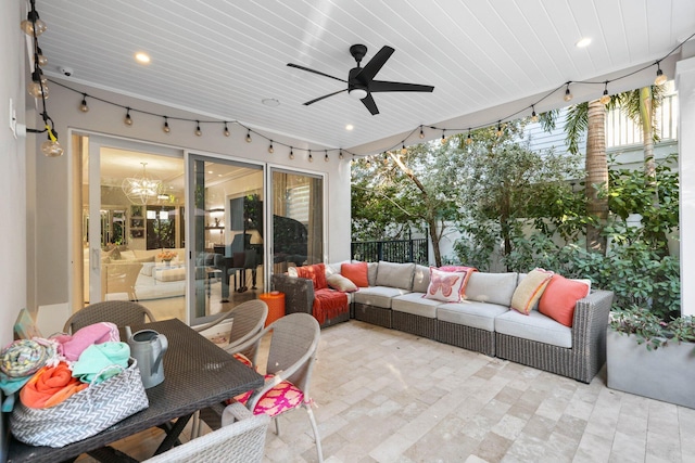 sunroom / solarium featuring ceiling fan with notable chandelier and wooden ceiling