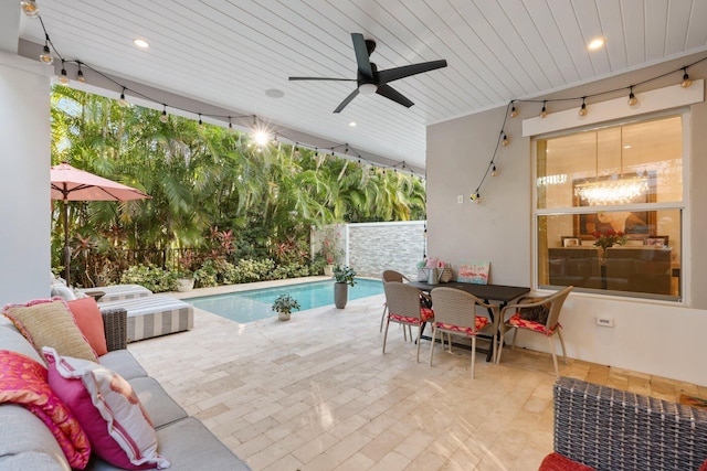 view of pool featuring a patio area, outdoor lounge area, and ceiling fan