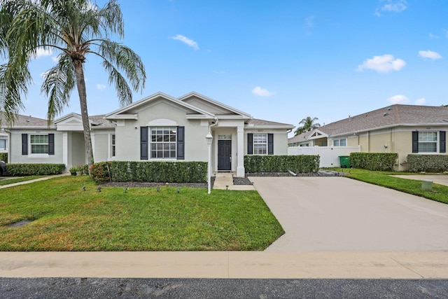 ranch-style home featuring a front yard