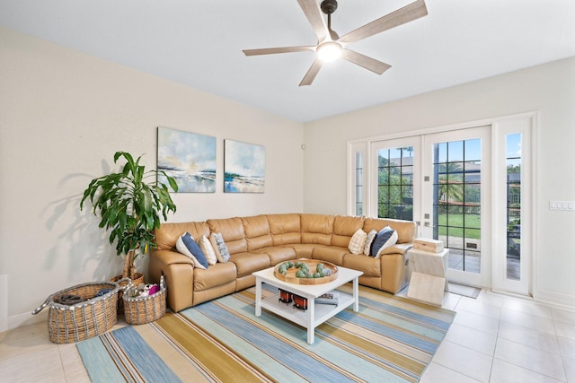 tiled living room with french doors and ceiling fan