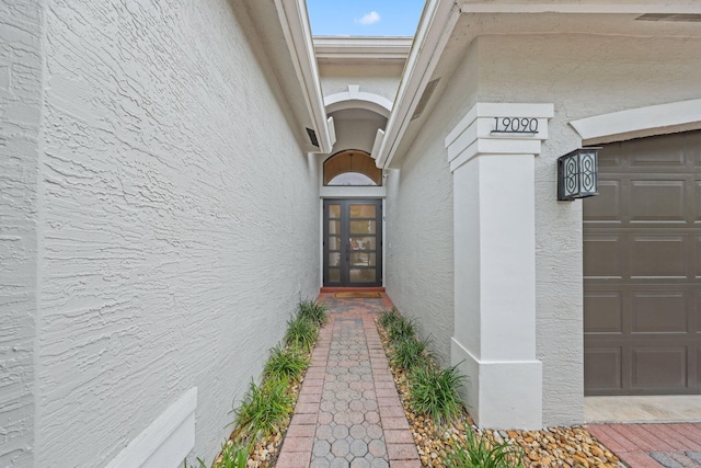 doorway to property featuring a garage