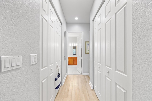 corridor featuring light hardwood / wood-style flooring