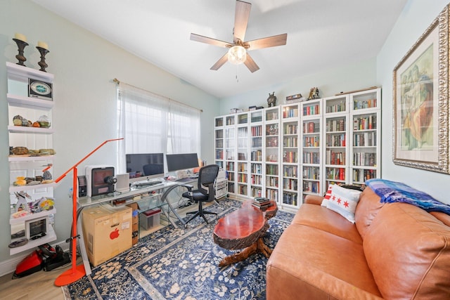 office area with wood-type flooring and ceiling fan