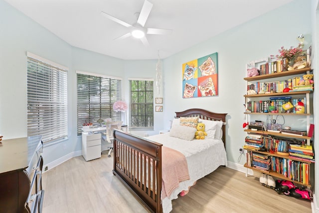 bedroom with ceiling fan and light hardwood / wood-style floors