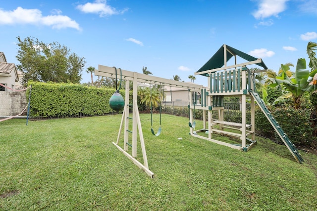 view of jungle gym with a lawn