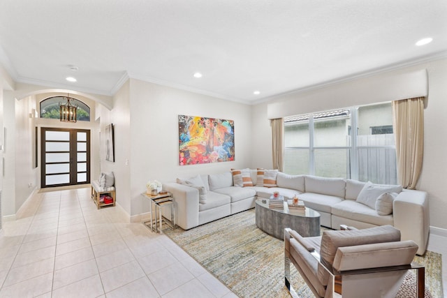 tiled living room featuring an inviting chandelier and crown molding