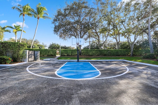 view of car parking featuring basketball court