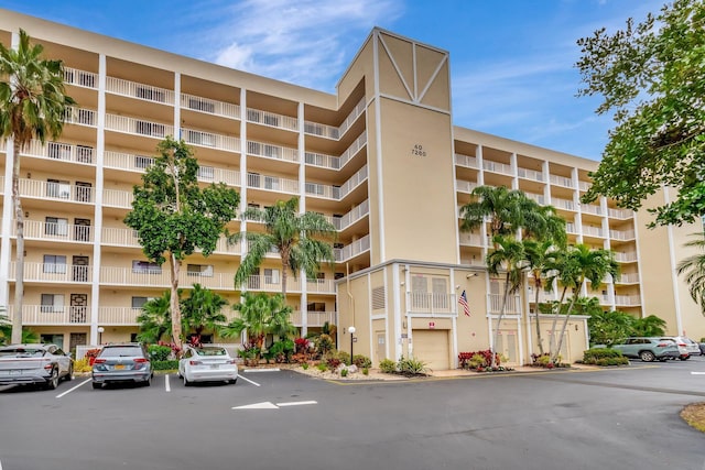 view of building exterior featuring uncovered parking