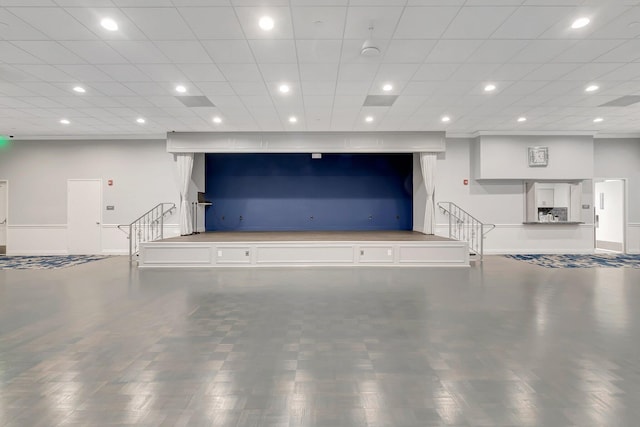 garage with recessed lighting and baseboards