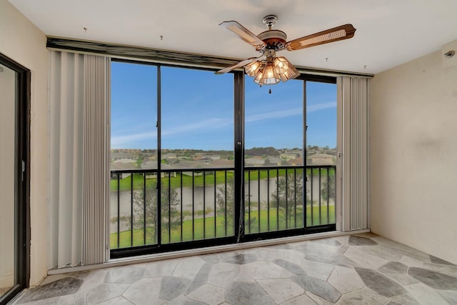 interior space featuring stone finish floor and ceiling fan