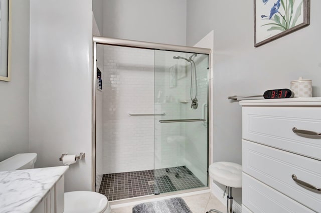 bathroom featuring walk in shower, tile patterned floors, and vanity