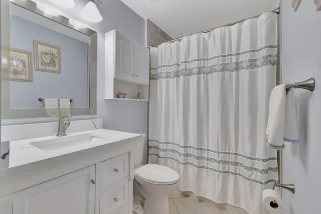 bathroom with a shower with curtain, vanity, tile patterned floors, and toilet