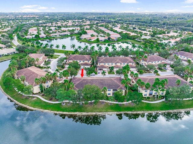 drone / aerial view with a water view and a residential view