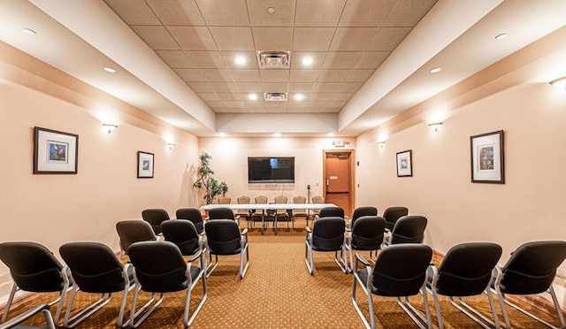 cinema room with light carpet, visible vents, and recessed lighting