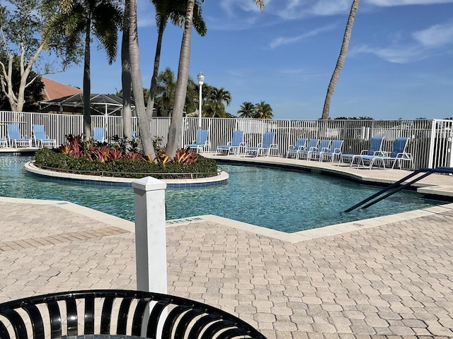 community pool featuring fence