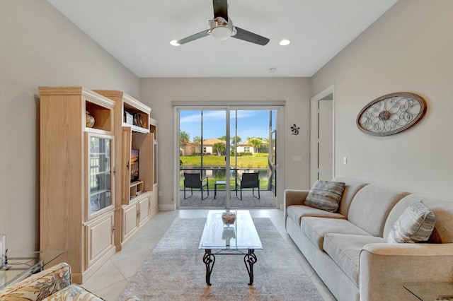 tiled living room with ceiling fan