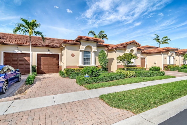 mediterranean / spanish-style house featuring a garage