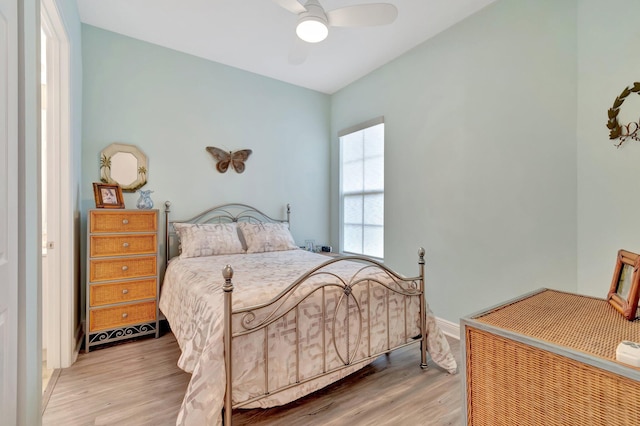 bedroom featuring hardwood / wood-style floors and ceiling fan