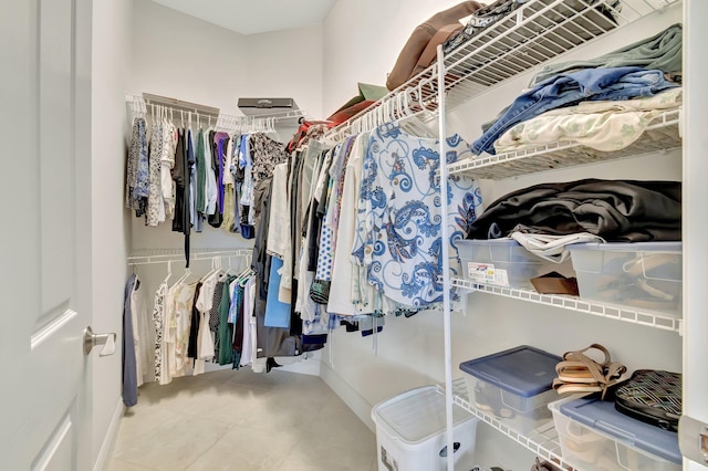 walk in closet featuring tile patterned flooring