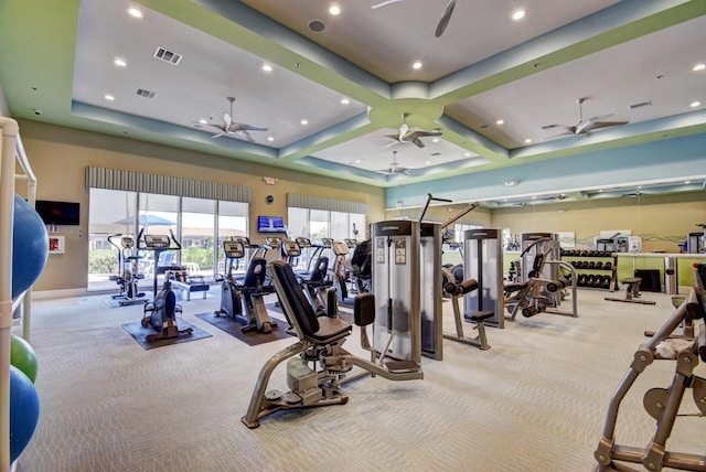 gym with light colored carpet and ceiling fan