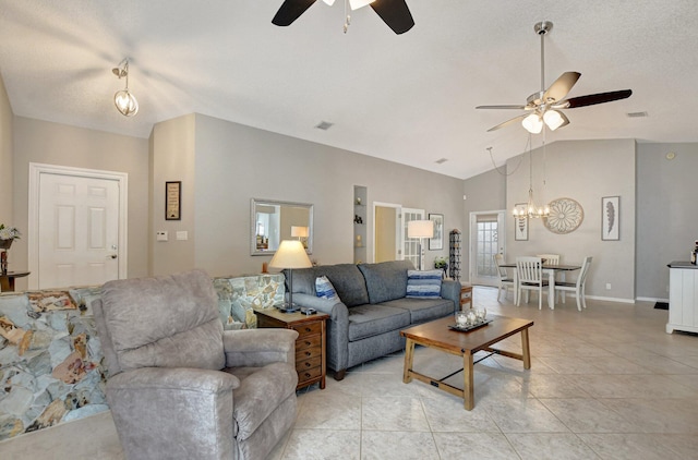 living room with lofted ceiling, ceiling fan with notable chandelier, a textured ceiling, and light tile patterned flooring