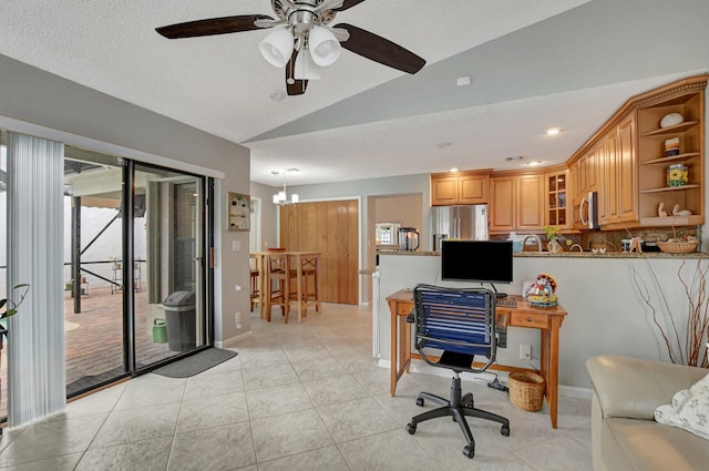 tiled office space with ceiling fan, vaulted ceiling, and a textured ceiling