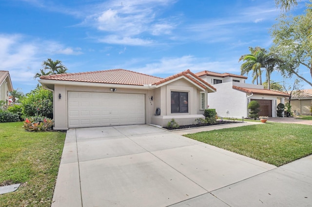 mediterranean / spanish house with a garage and a front lawn