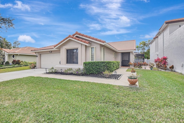 view of front of home with a garage and a front yard