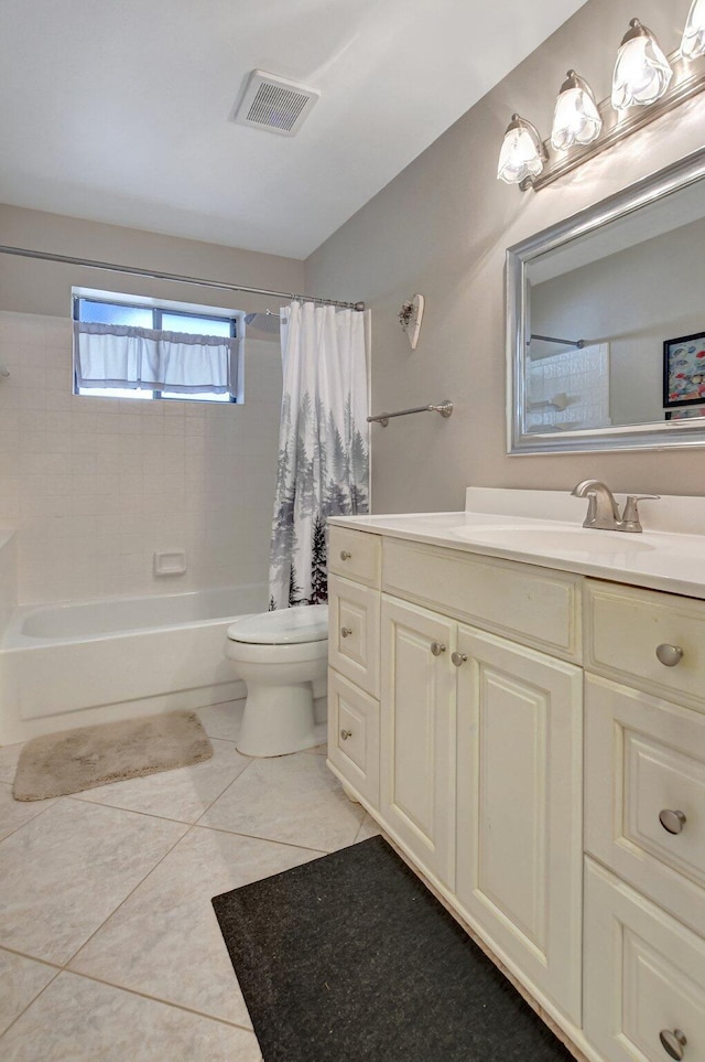 full bathroom with tile patterned floors, vanity, toilet, and shower / tub combo