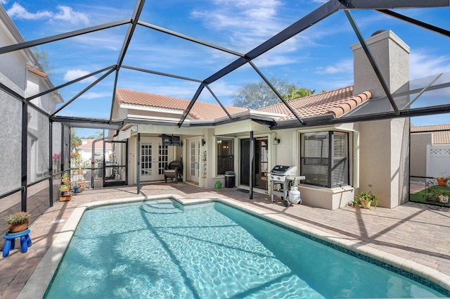 back of house featuring a lanai, a patio area, and ceiling fan