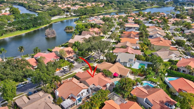 birds eye view of property featuring a water view