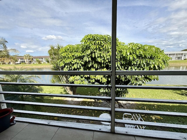 view of gate with a water view