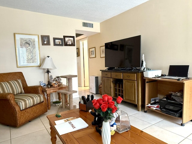 tiled living room with a textured ceiling