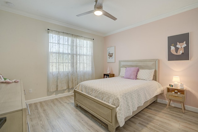 bedroom featuring ceiling fan, ornamental molding, and light hardwood / wood-style flooring