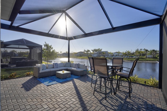 view of patio / terrace with an outdoor living space and a water view