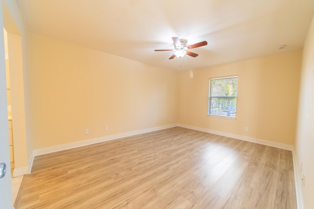 unfurnished room with ceiling fan and light hardwood / wood-style floors