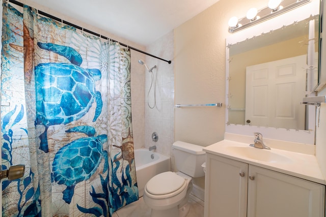 full bathroom with vanity, shower / bath combo with shower curtain, and toilet