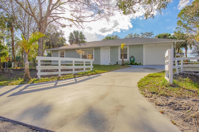 single story home featuring a garage