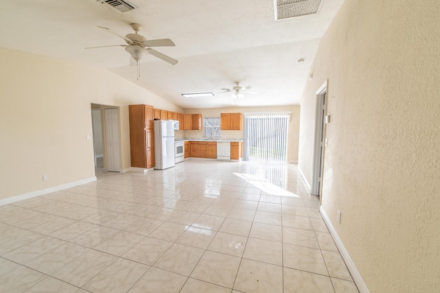 unfurnished living room with vaulted ceiling and ceiling fan