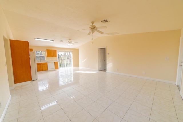 empty room featuring light tile patterned flooring, ceiling fan, lofted ceiling, and sink